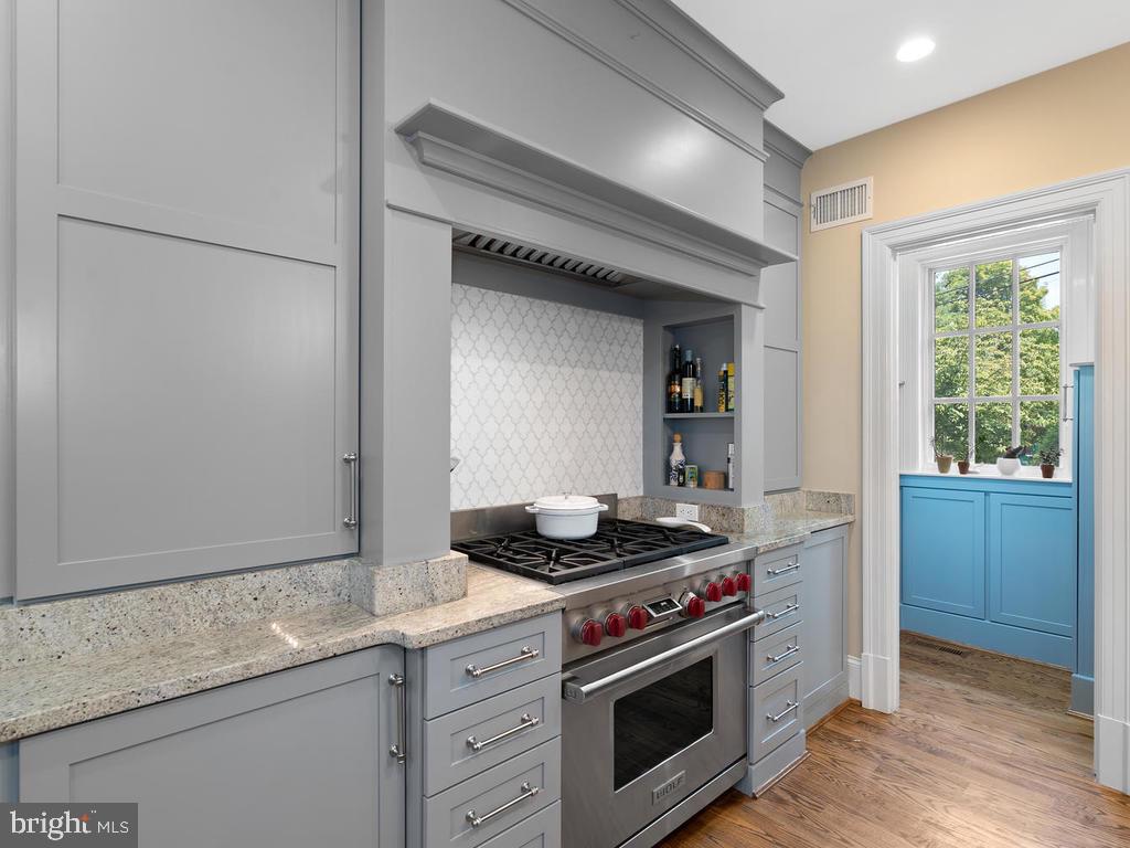 4400 Elm Street Chevy Chase, MD 20815 - Photo 56 of 61 a kitchen with stainless steel appliances granite countertop a stove and a sink