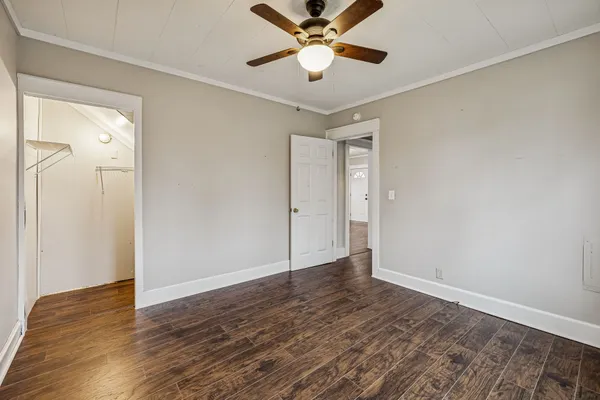 a view of an empty room and wooden floor