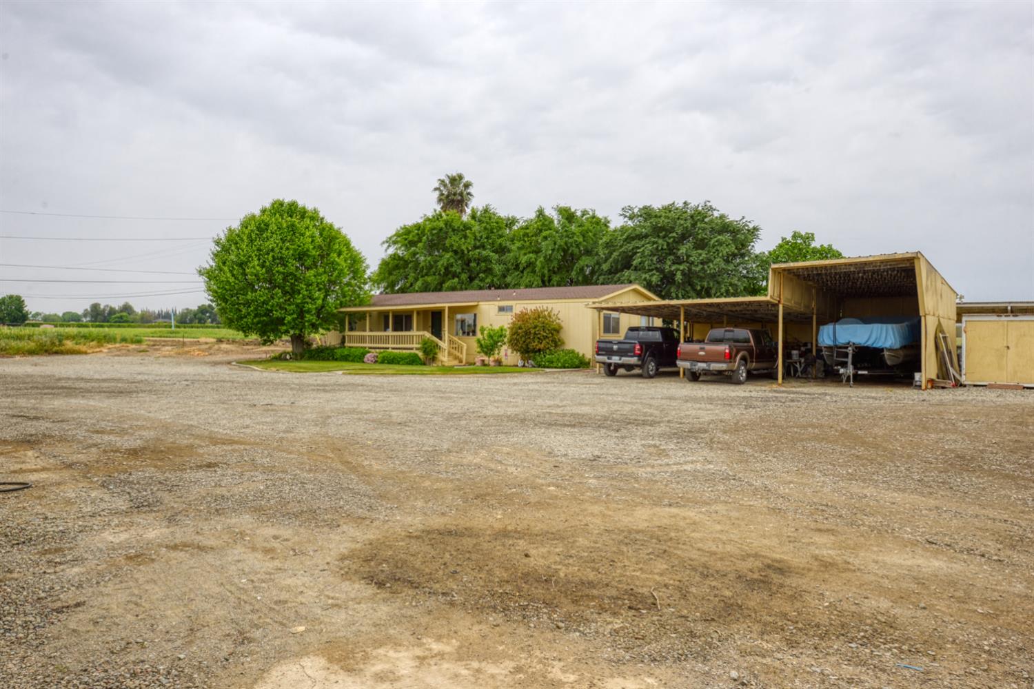 1471 Highway 33 Gustine, CA 95322 - Photo 36 of 57 a view of house with outdoor space and car parked