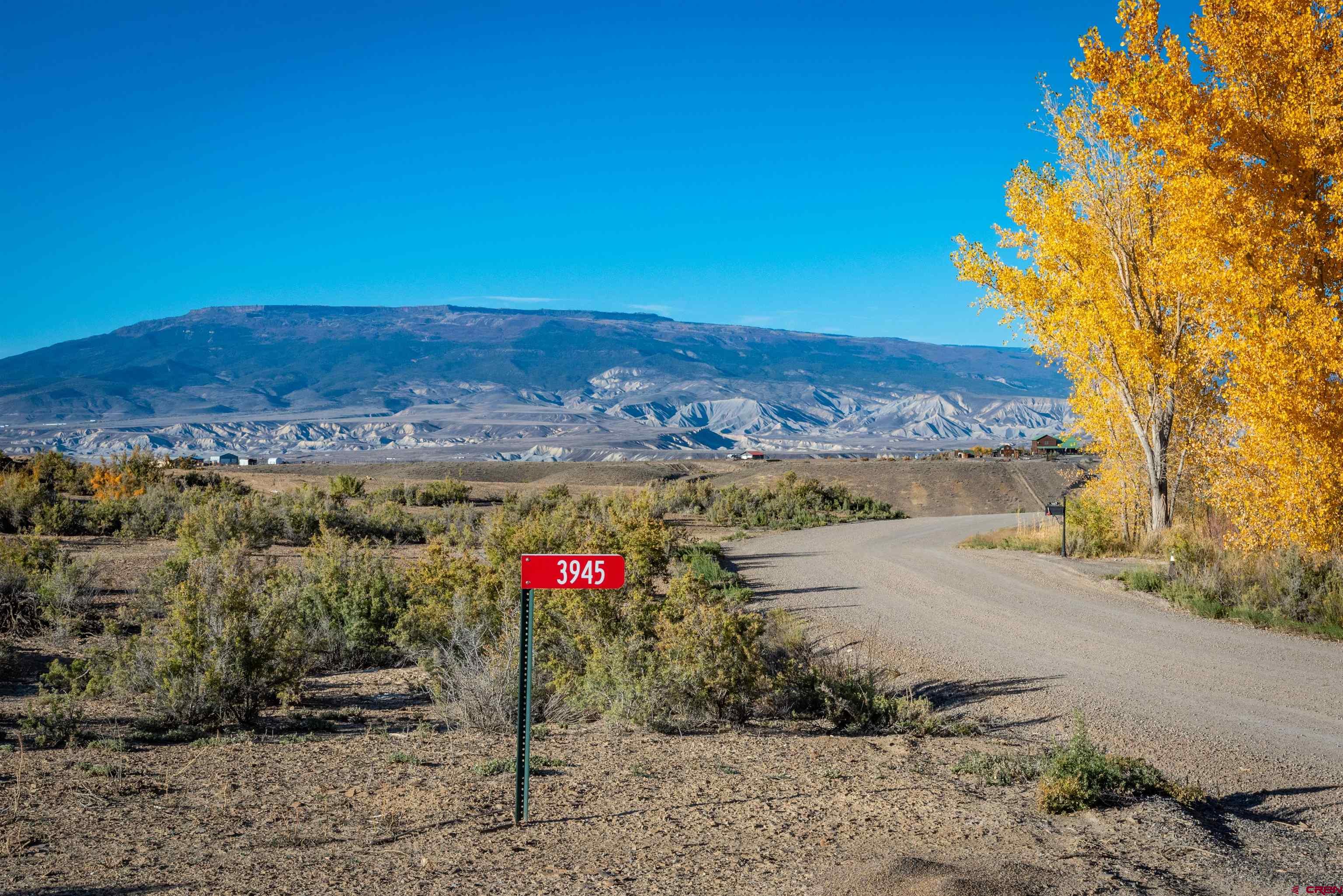 3945 Sundown Road Delta, CO 81416 - Photo 1 of 30 a view of a road with a building in the background