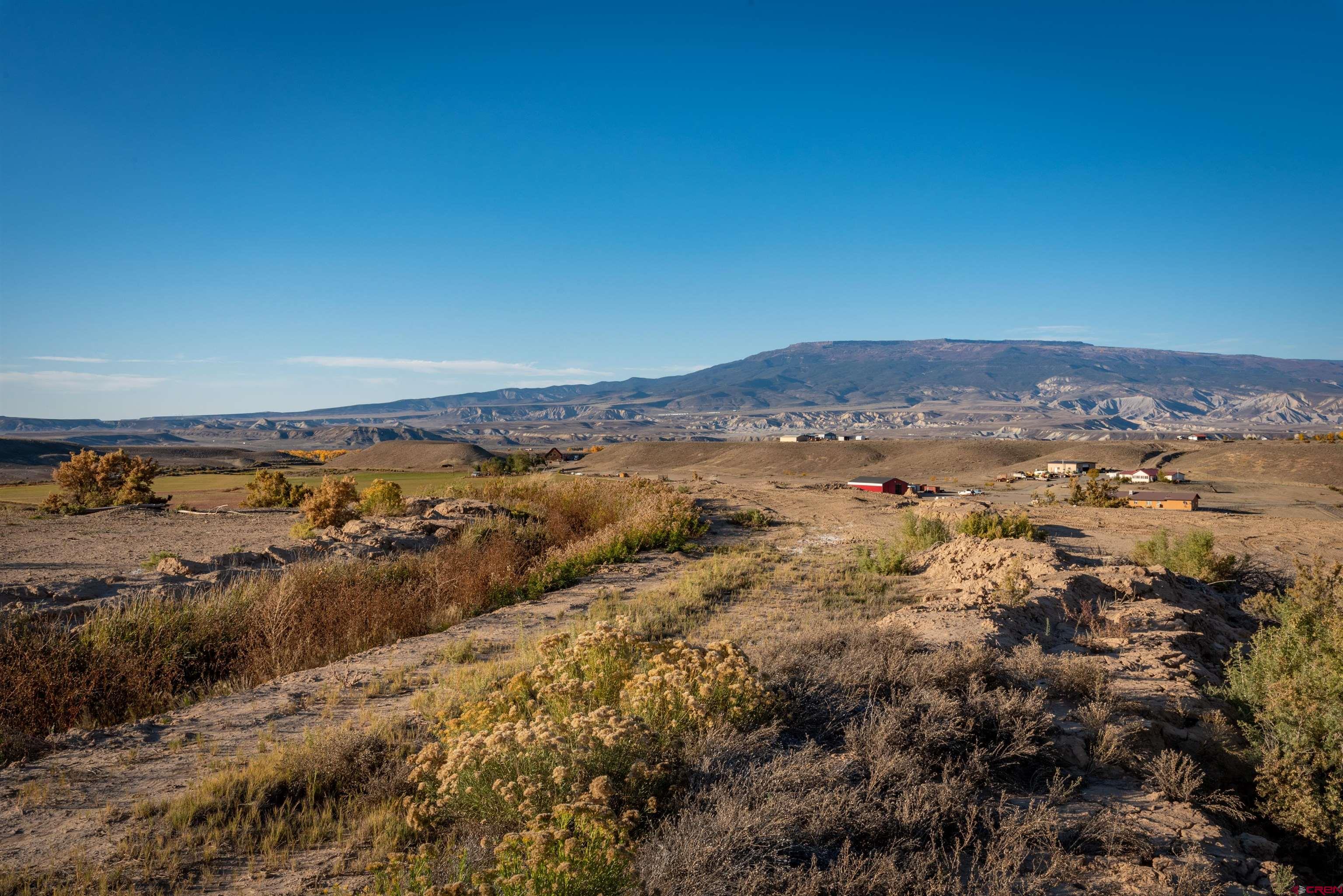 3945 Sundown Road Delta, CO 81416 - Photo 16 of 30 a view of ocean with beach