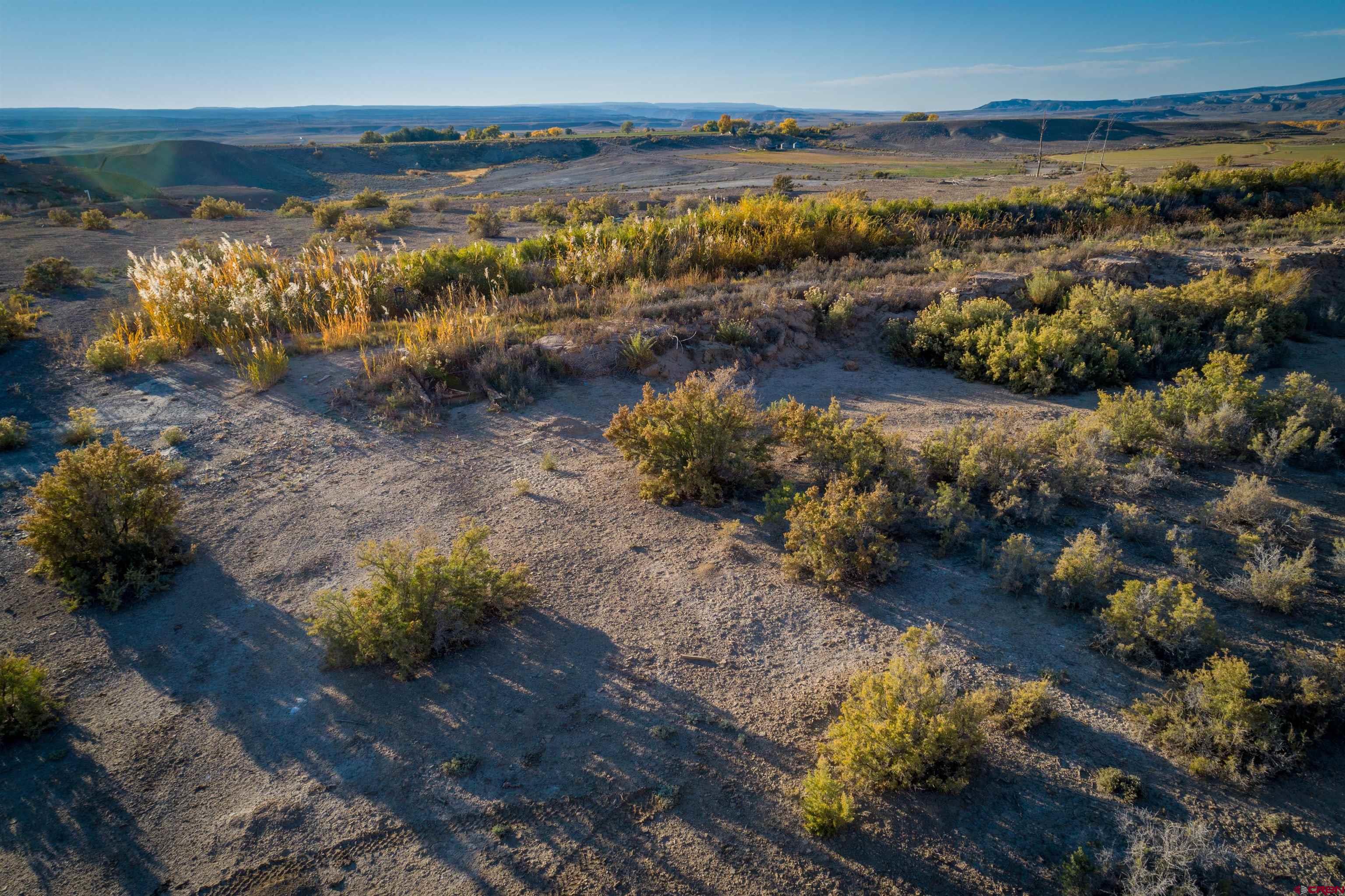 3945 Sundown Road Delta, CO 81416 - Photo 17 of 30 a view of a lake with a mountain