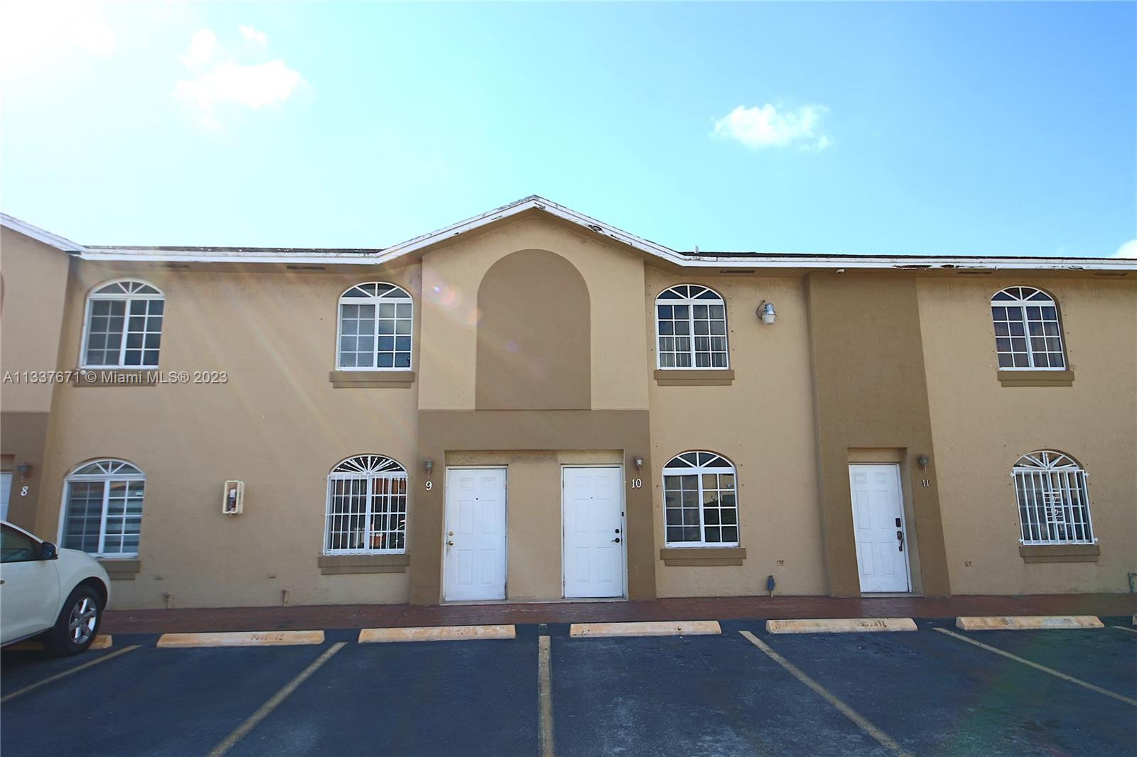 655 West 68th Street, Unit 10 Hialeah, FL 33014 - Photo 1 of 19 a view of a house with a garage