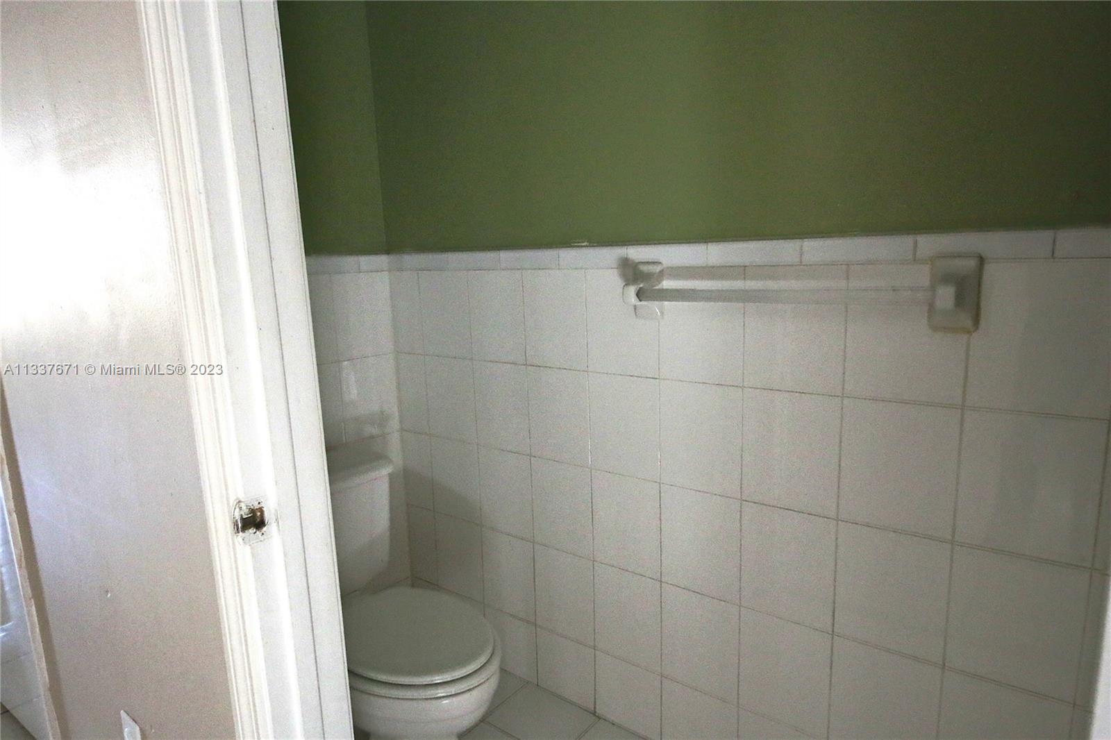 655 West 68th Street, Unit 10 Hialeah, FL 33014 - Photo 11 of 19 a bathroom with a toilet and a shower