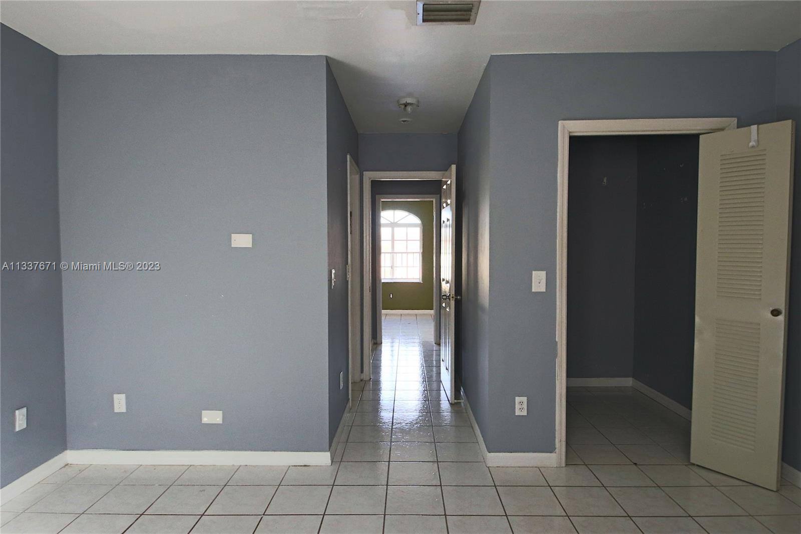 655 West 68th Street, Unit 10 Hialeah, FL 33014 - Photo 12 of 19 a view of a hallway with interior of a house