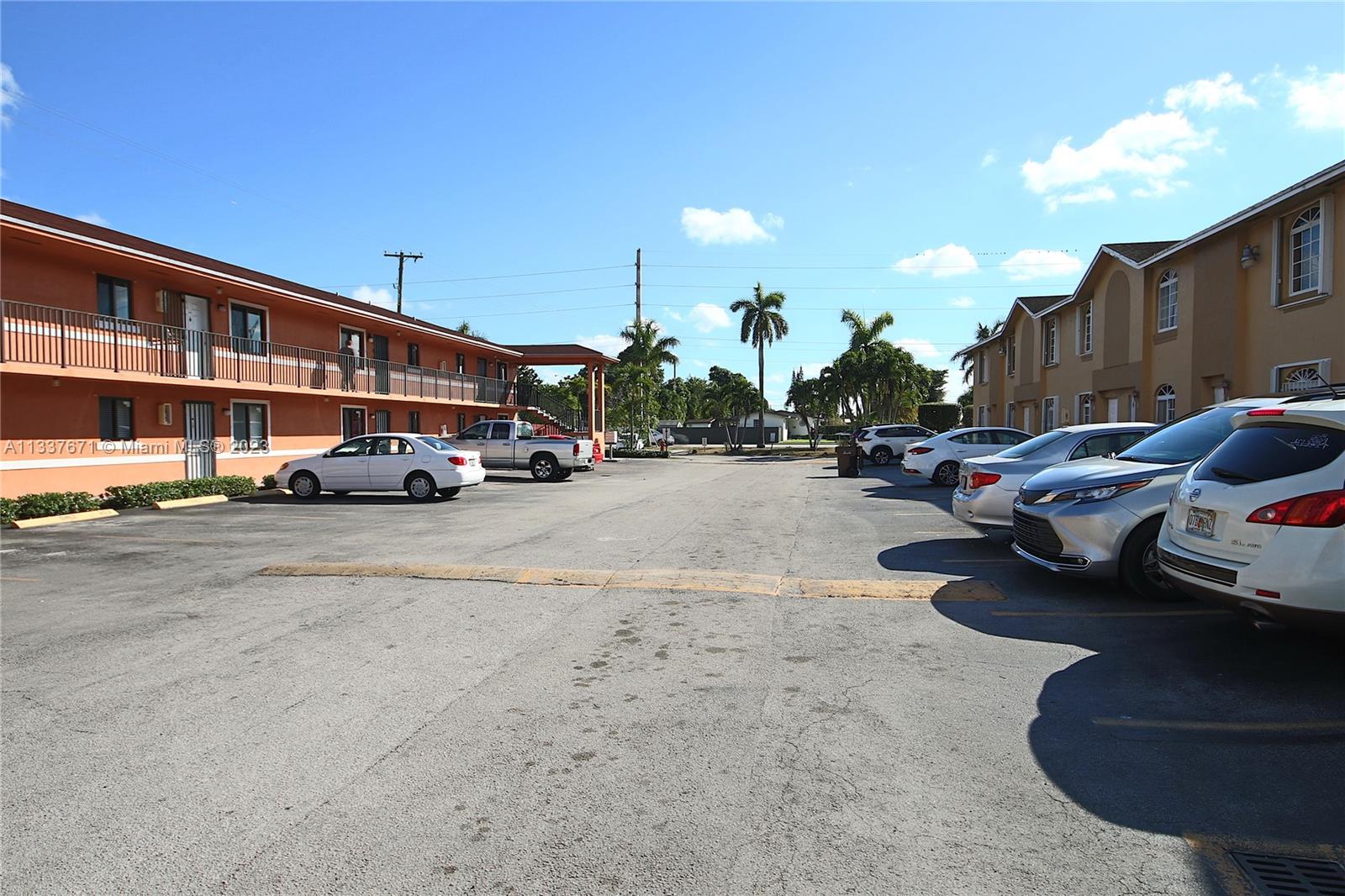 655 West 68th Street, Unit 10 Hialeah, FL 33014 - Photo 19 of 19 a car parked on the side of a street