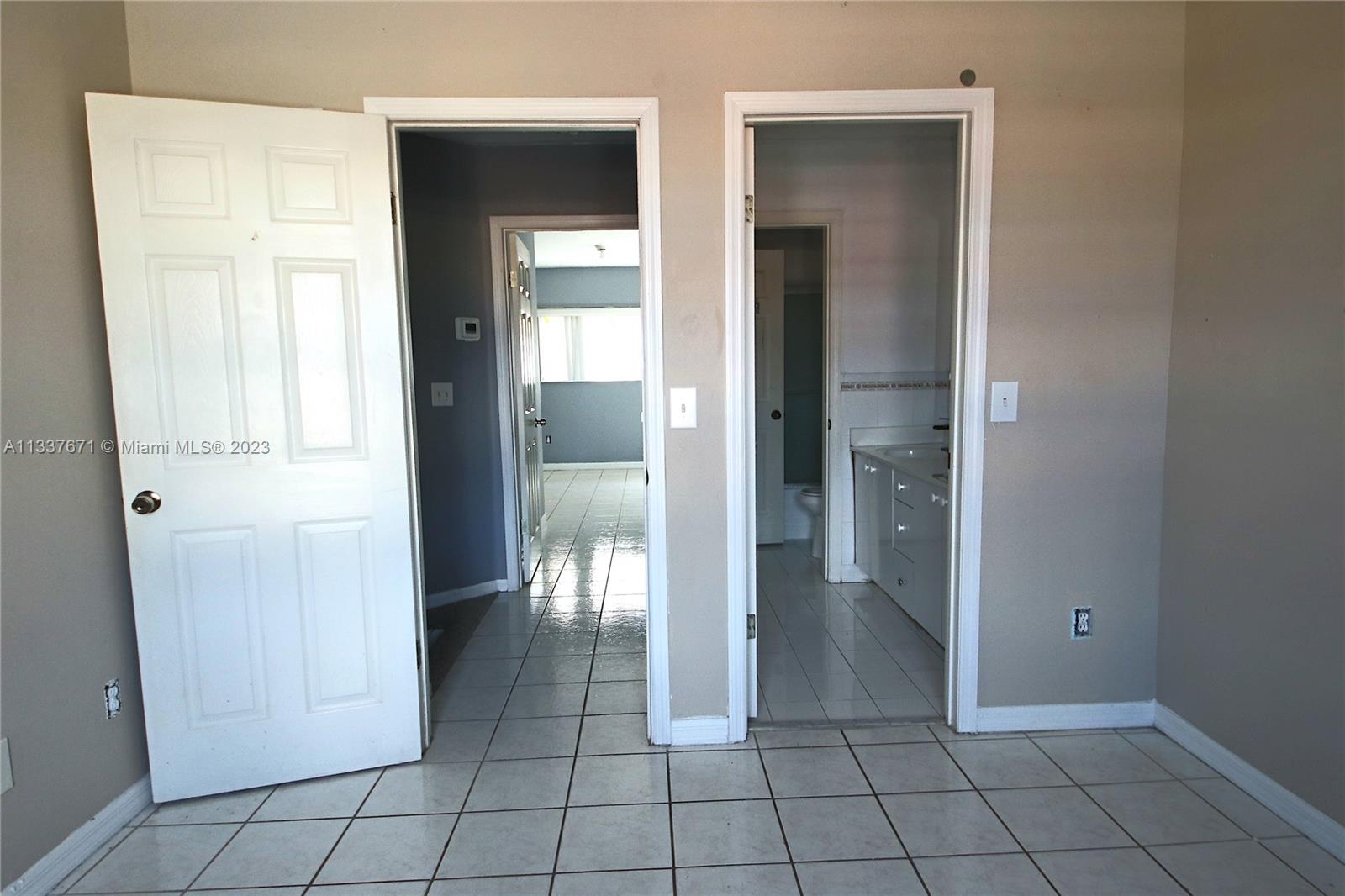 655 West 68th Street, Unit 10 Hialeah, FL 33014 - Photo 7 of 19 a view of an empty room and closet area