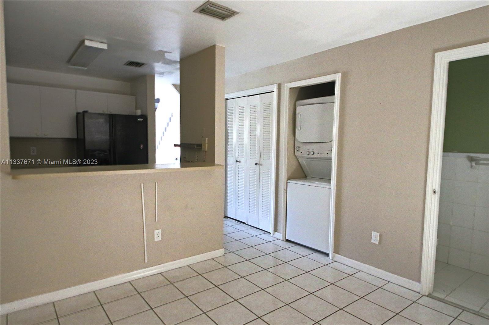 655 West 68th Street, Unit 10 Hialeah, FL 33014 - Photo 9 of 19 a view of a kitchen cabinets