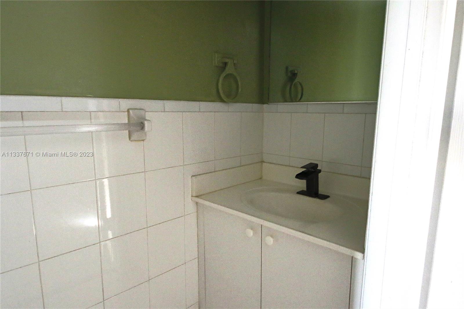 655 West 68th Street, Unit 10 Hialeah, FL 33014 - Photo 10 of 19 a bathroom with a sink and a shower