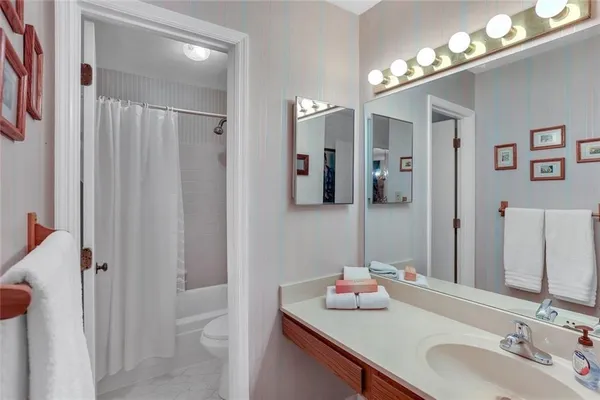 a bathroom with a sink double vanity and a mirror