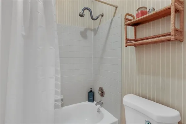 a bathroom with a toilet and a sink