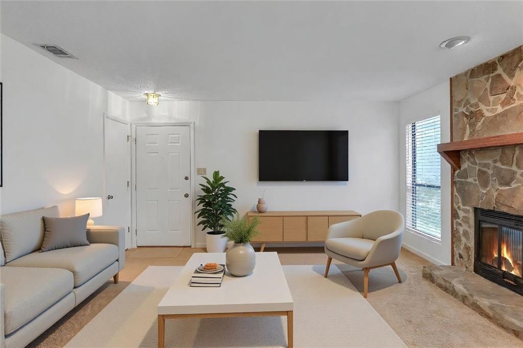 3445 Ivys Walk Atlanta, GA 30340 - Photo 2 of 21 a living room with furniture a fireplace and a flat screen tv