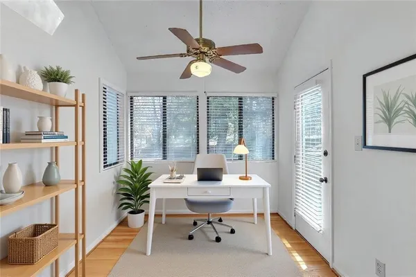 a workspace with furniture and window
