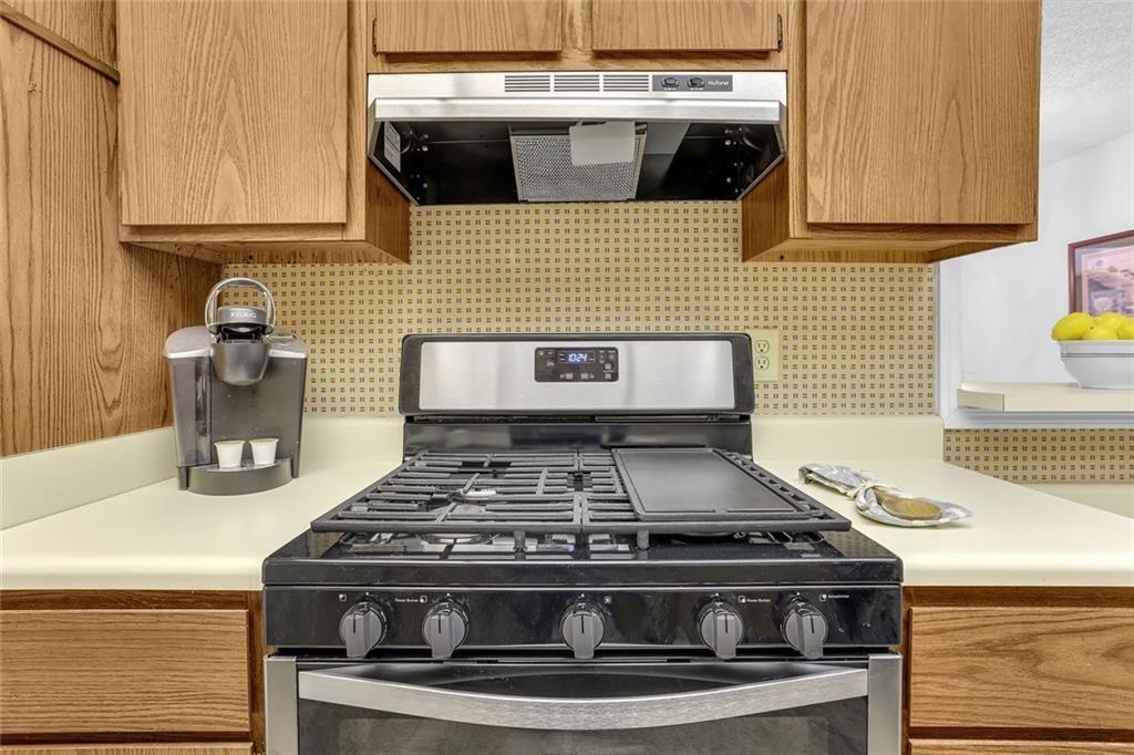 3445 Ivys Walk Atlanta, GA 30340 - Photo 7 of 21 a stove top oven sitting inside of a kitchen