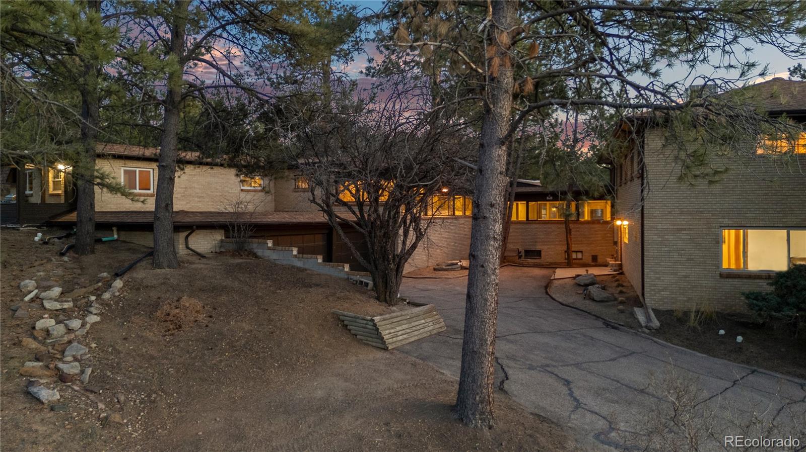 7076 Inspiration Drive Parker, CO 80138 - Photo 29 of 50 a backyard of a house with barbeque oven table and chairs