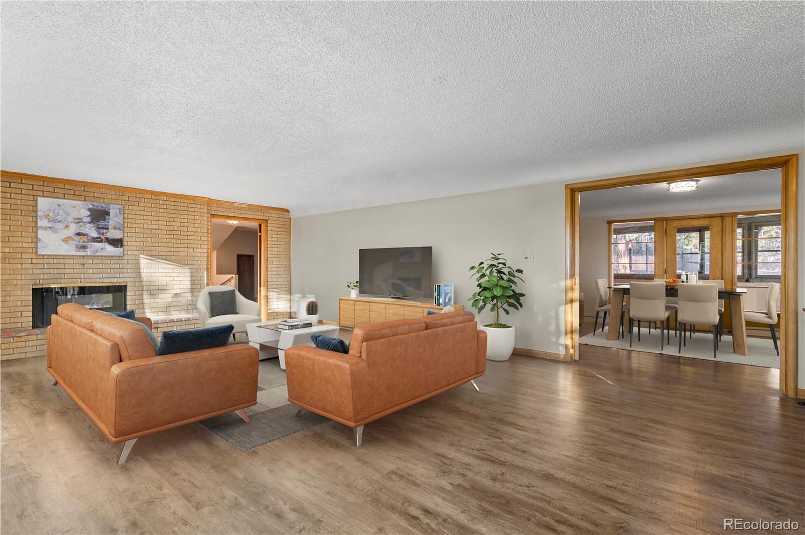 7076 Inspiration Drive Parker, CO 80138 - Photo 10 of 50 a living room with furniture and a table