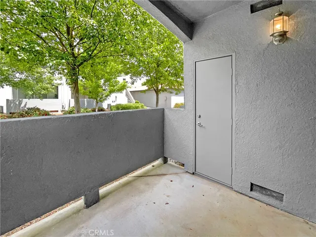 a front view of a house with a yard and a garden