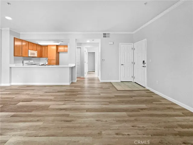 a view of kitchen and empty room
