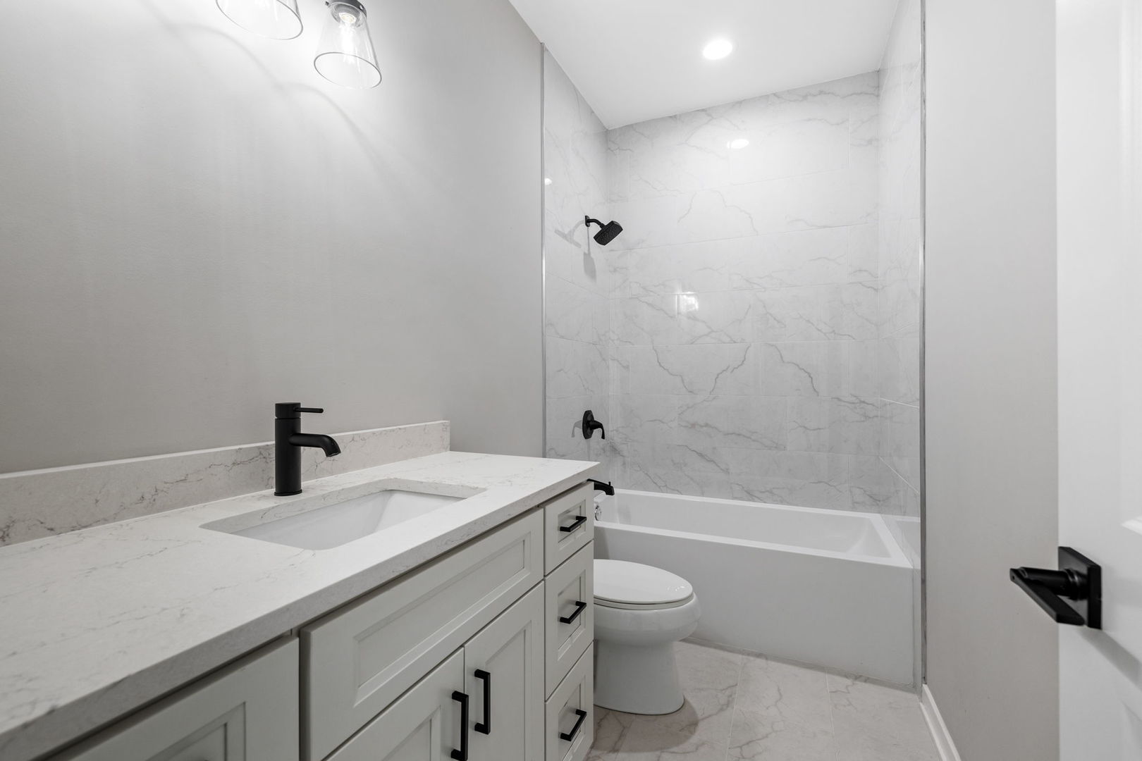 203 Hickory Street Peotone, IL 60468 - Photo 14 of 20 a bathroom with a sink a toilet and shower