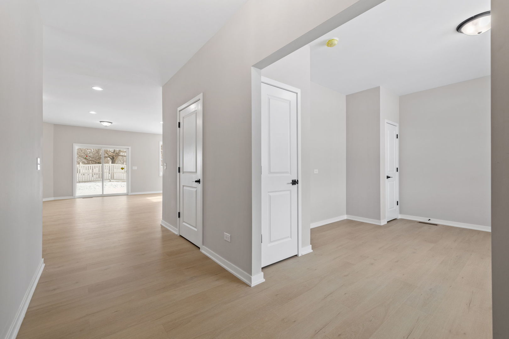 203 Hickory Street Peotone, IL 60468 - Photo 2 of 20 a view of a hallway with wooden floor