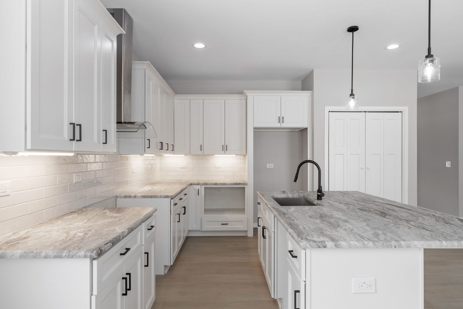 203 Hickory Street Peotone, IL 60468 - Photo 5 of 20 a kitchen with a sink stove and cabinets