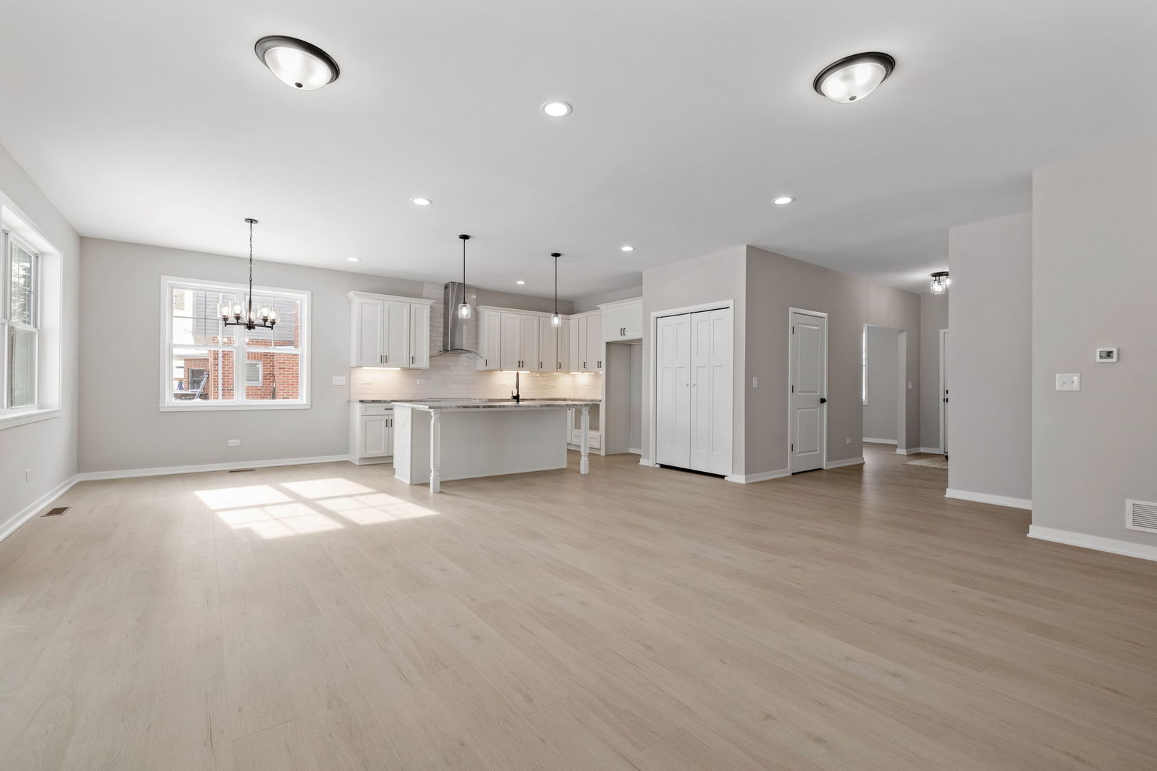203 Hickory Street Peotone, IL 60468 - Photo 6 of 20 a view of an empty room with a kitchen