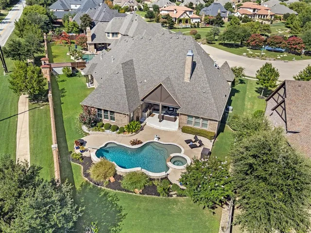 an aerial view of residential house with outdoor space and parking
