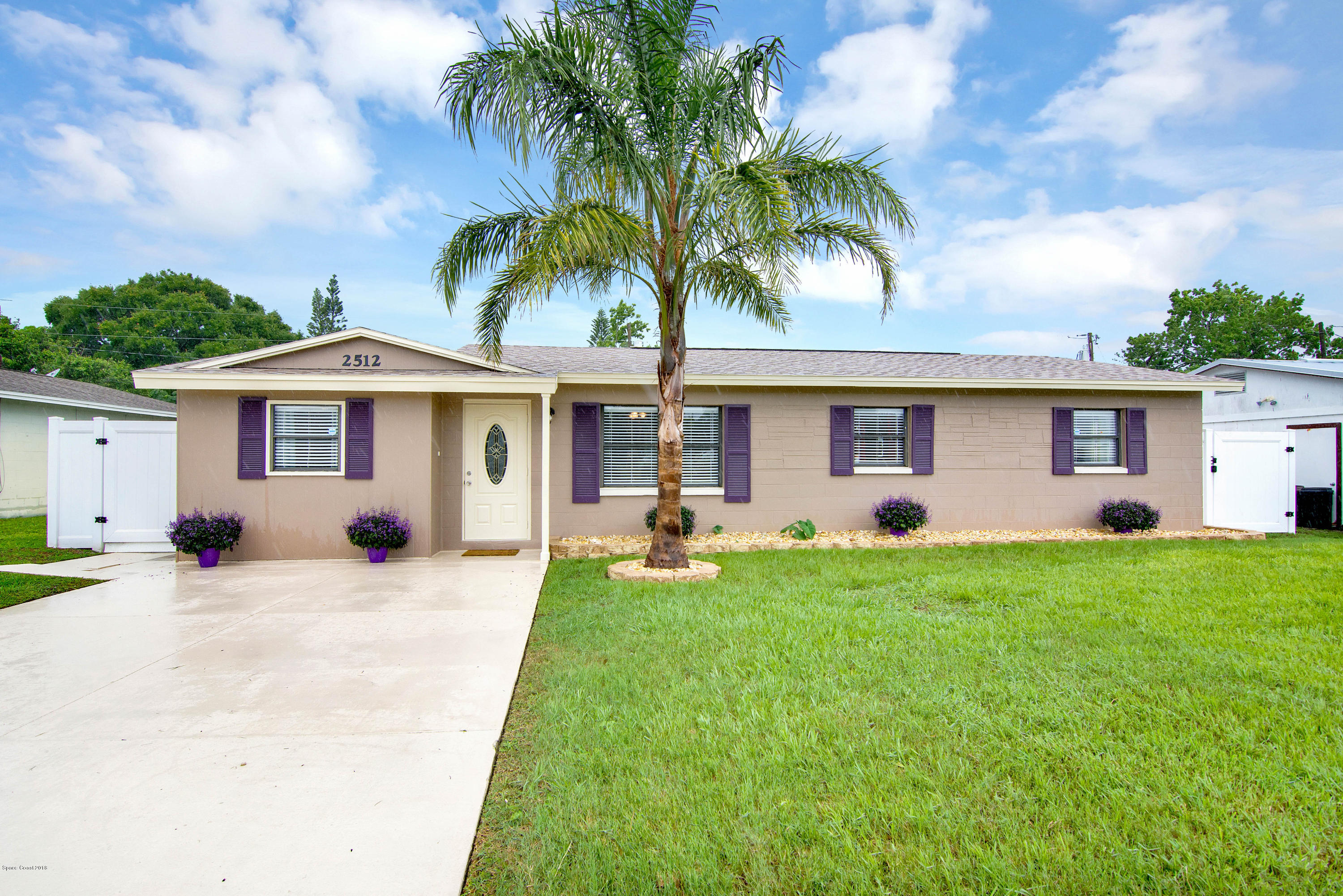 2512 Post Road Melbourne, FL 32935 - Photo 1 of 25 a front view of house with yard and porch