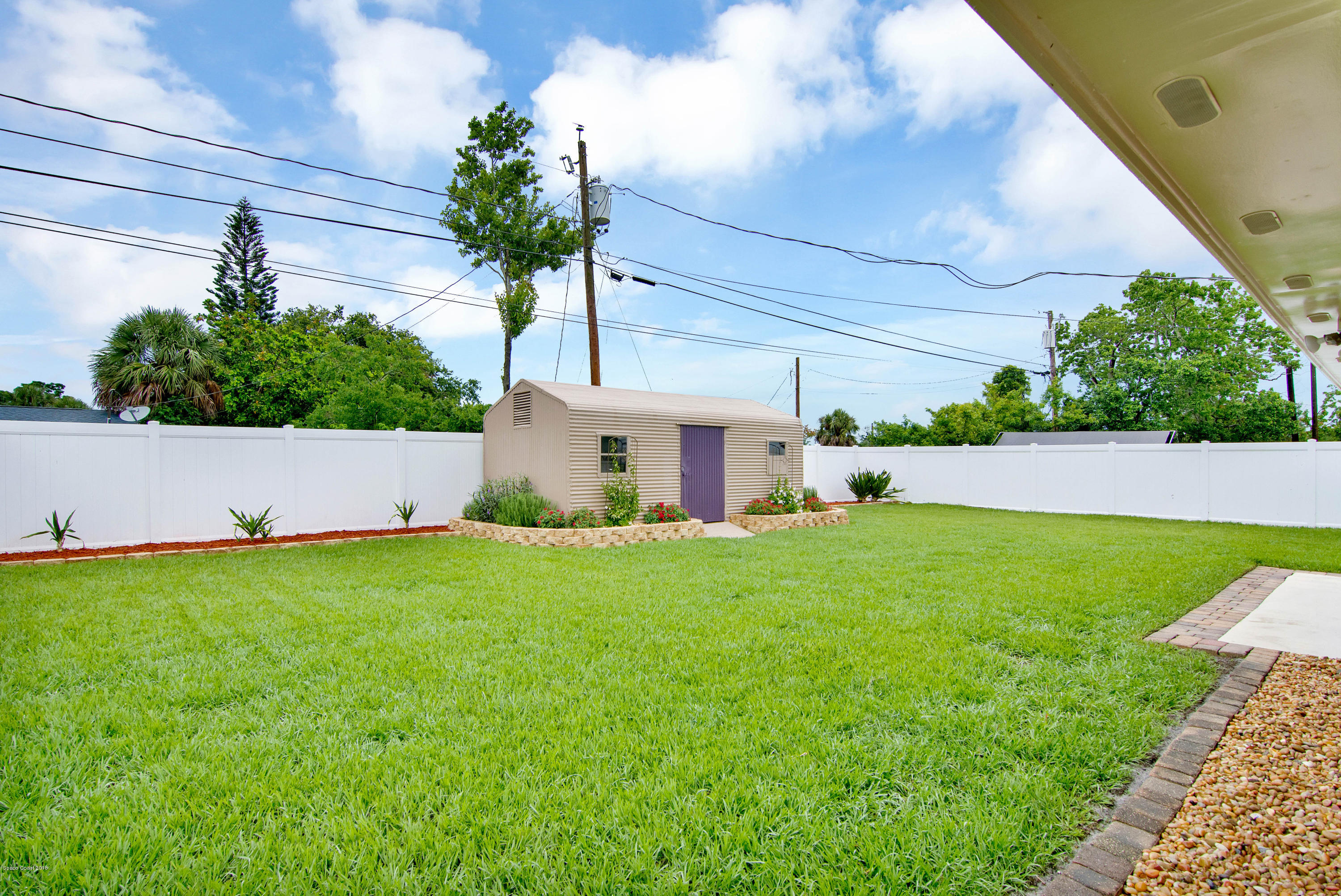 2512 Post Road Melbourne, FL 32935 - Photo 2 of 25 a house view with a garden space
