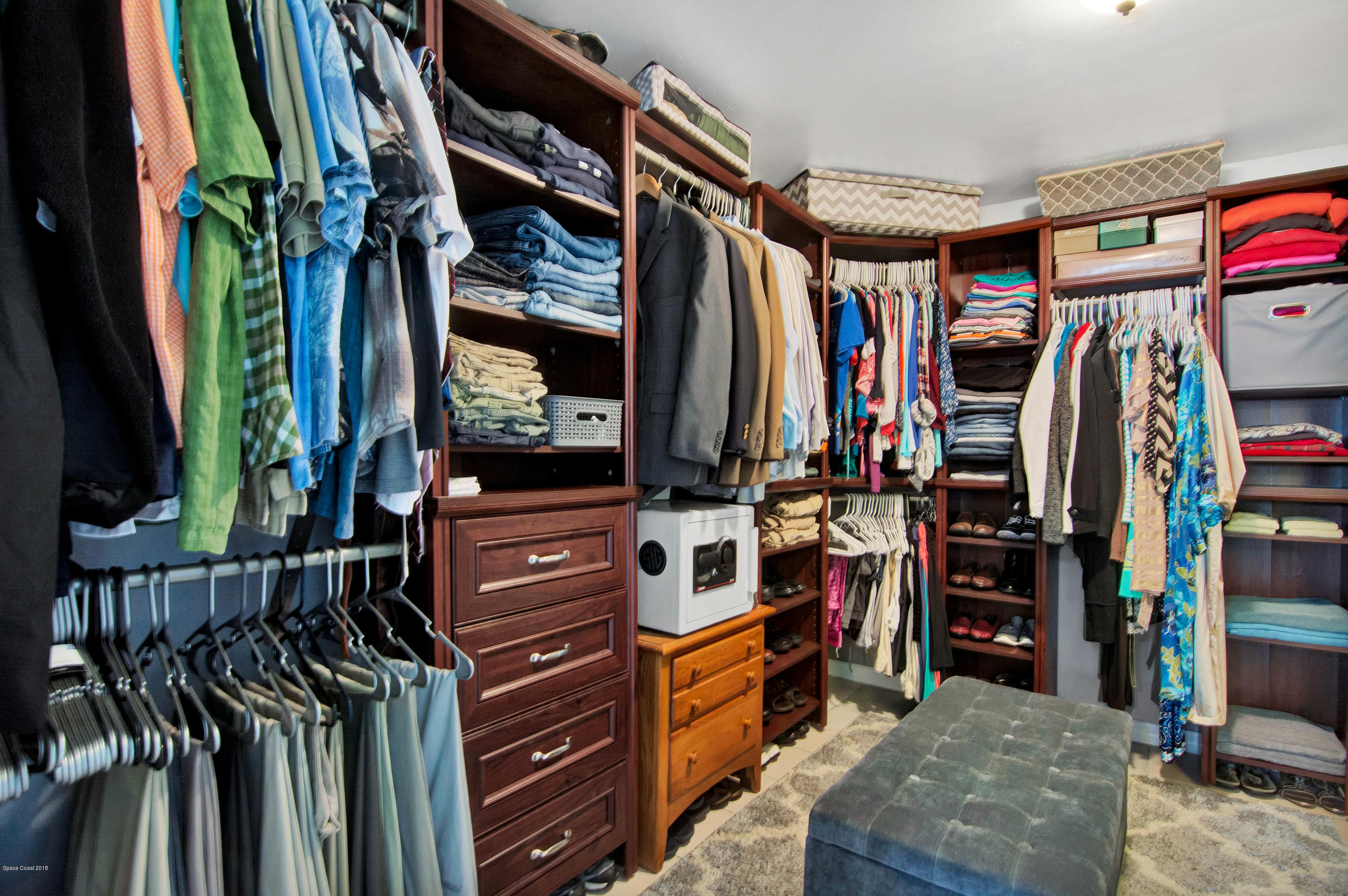 2512 Post Road Melbourne, FL 32935 - Photo 16 of 25 a view of walk in closet with clothes and shoes
