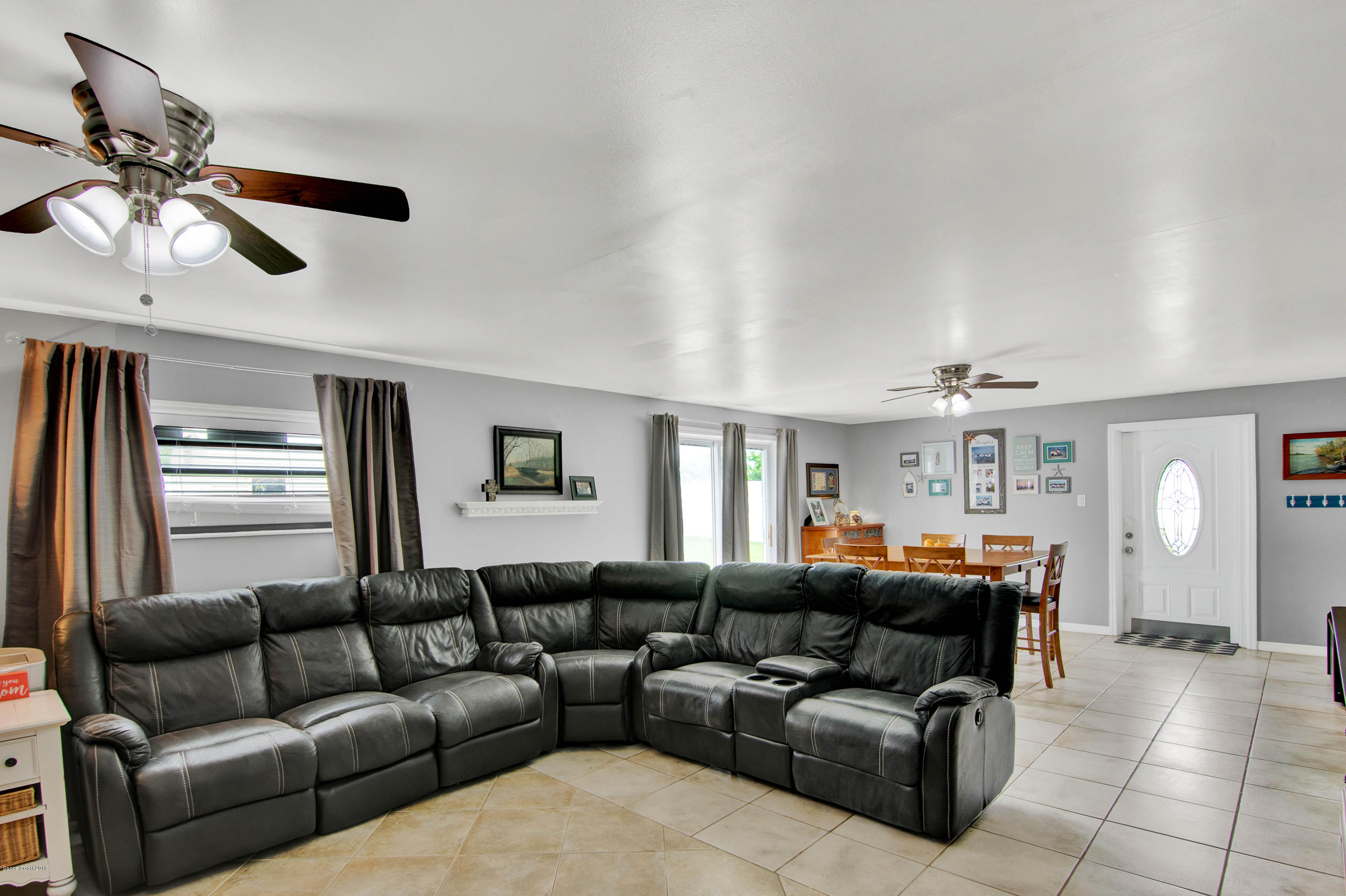2512 Post Road Melbourne, FL 32935 - Photo 19 of 25 a living room with furniture and a large window