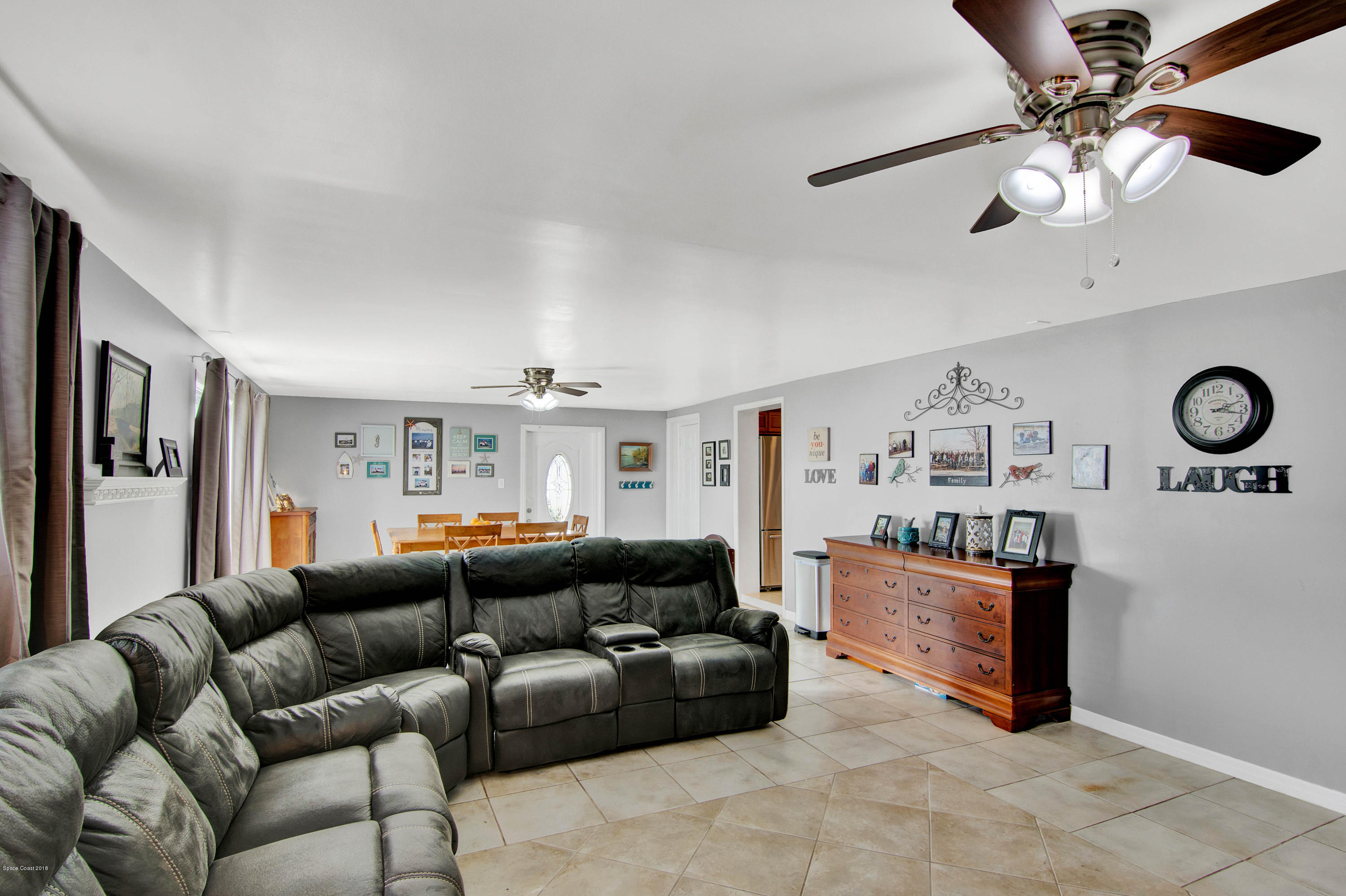 2512 Post Road Melbourne, FL 32935 - Photo 20 of 25 a living room with furniture and a large window