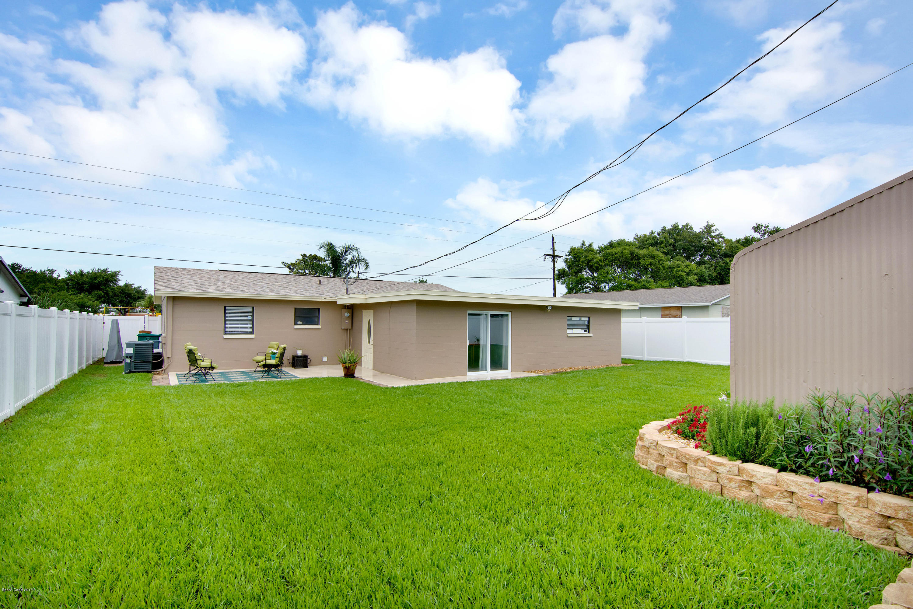 2512 Post Road Melbourne, FL 32935 - Photo 3 of 25 a view of a house with a yard