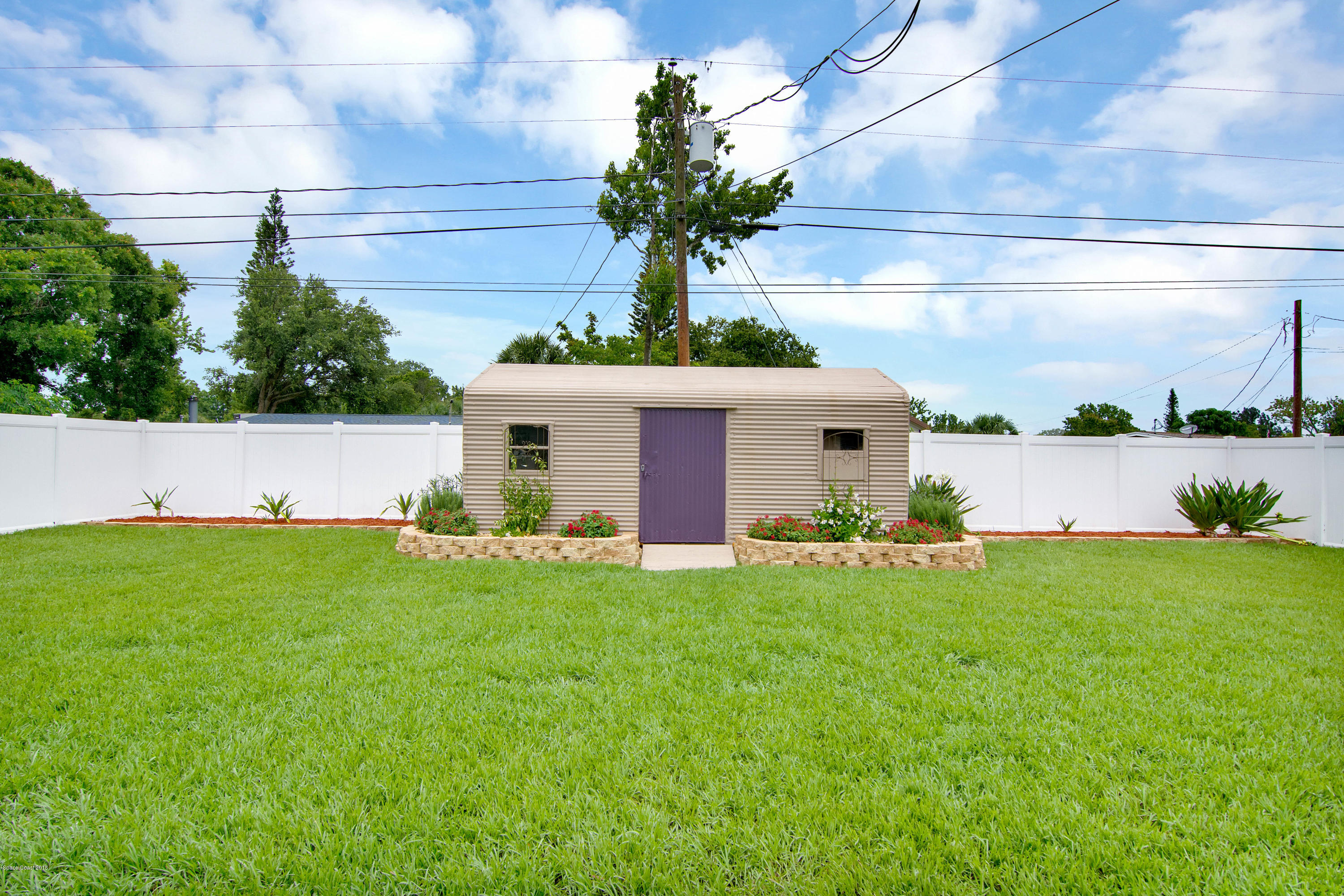 2512 Post Road Melbourne, FL 32935 - Photo 22 of 25 a front view of a house with garden