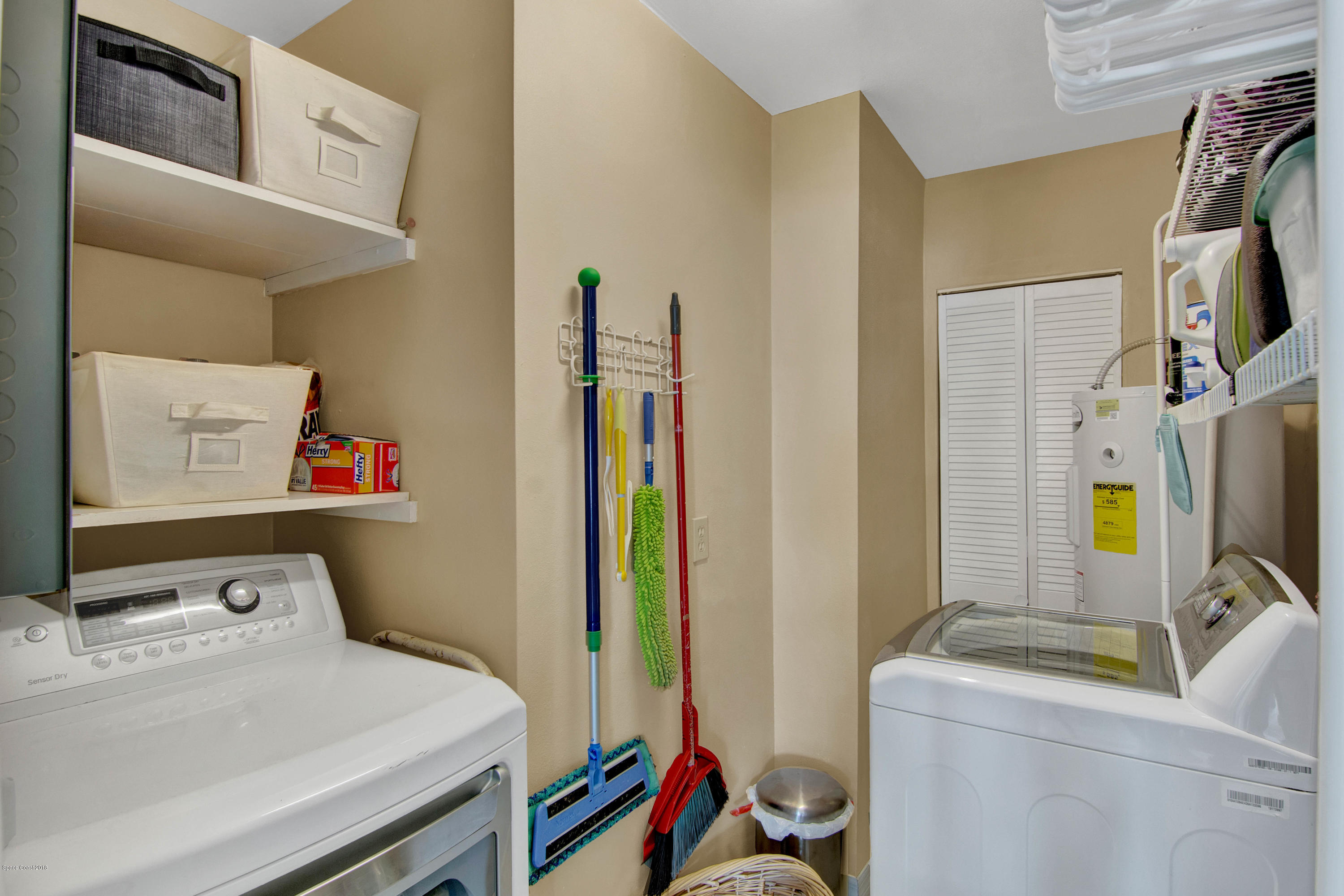 2512 Post Road Melbourne, FL 32935 - Photo 23 of 25 a room with a bed and a flat screen tv