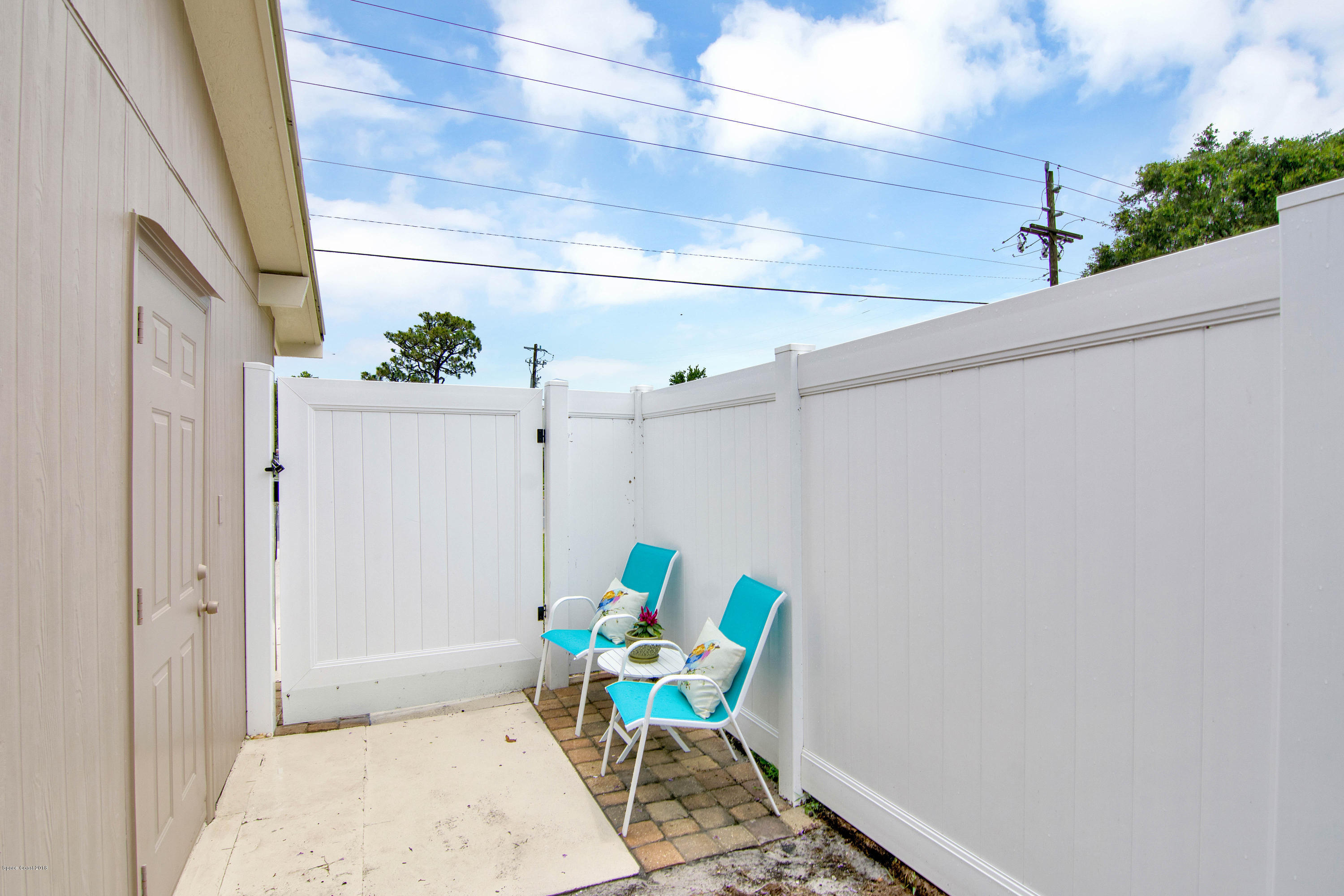 2512 Post Road Melbourne, FL 32935 - Photo 25 of 25 a view of patio with a table and chairs