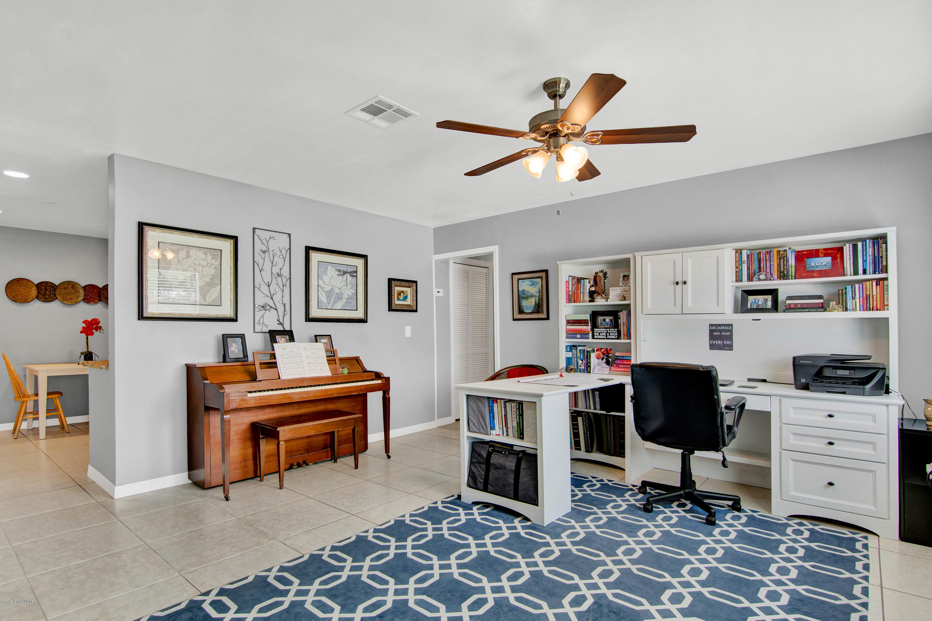 2512 Post Road Melbourne, FL 32935 - Photo 4 of 25 a living room with furniture a piano and a window