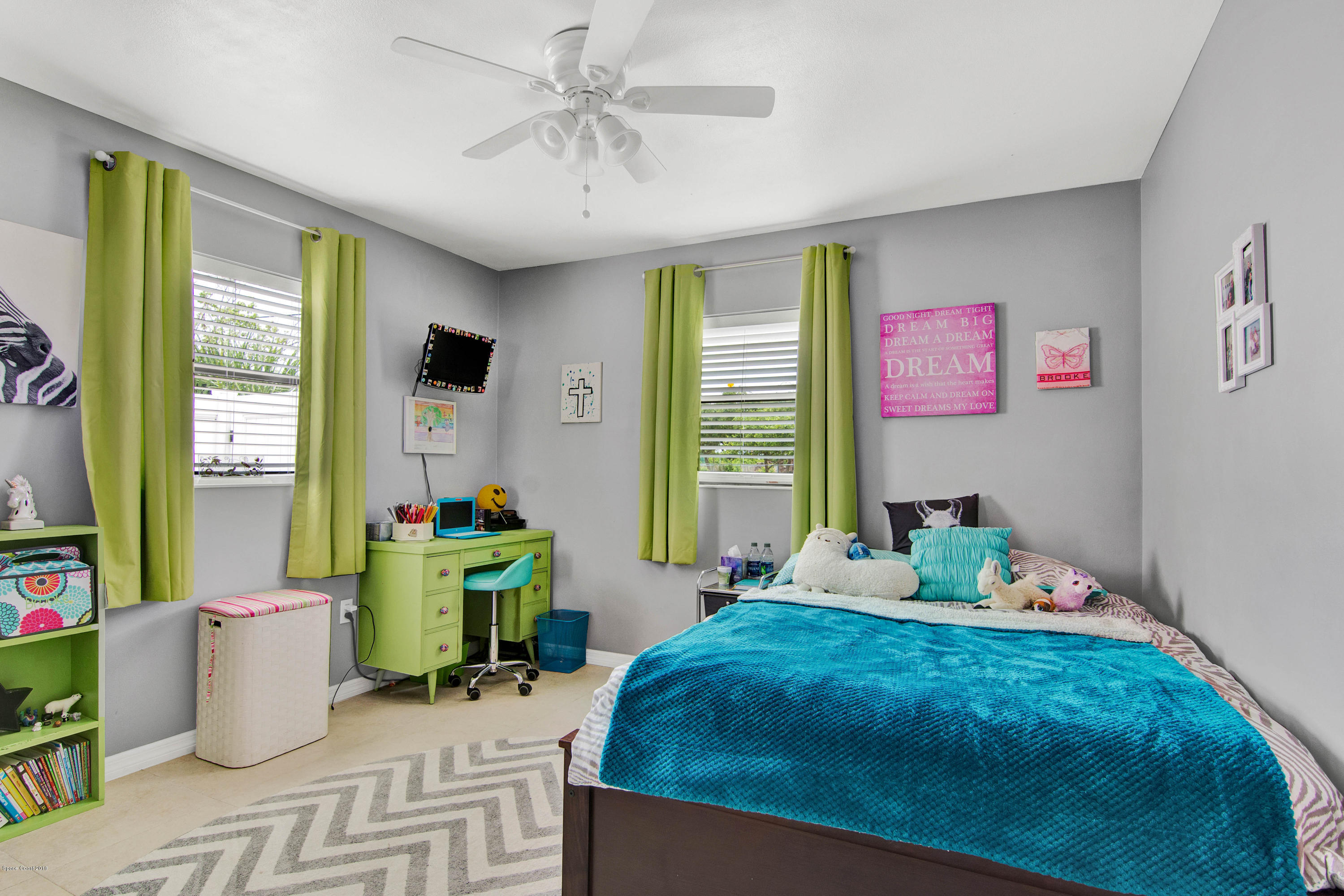 2512 Post Road Melbourne, FL 32935 - Photo 8 of 25 a bedroom with a bed table and chair