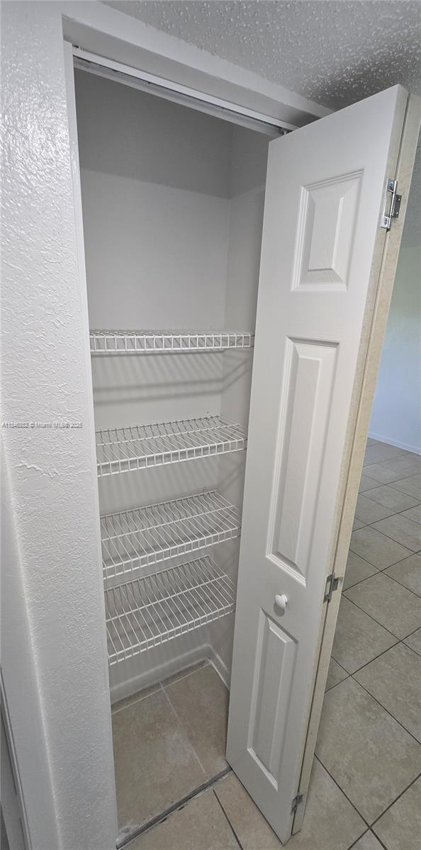 10820 Southwest 200th Drive, Unit 159 Cutler Bay, FL 33157 - Photo 6 of 17 a view of walk in closet