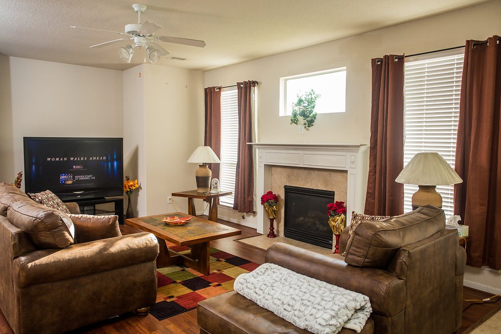 2930 Westerfield Lane Houston, TX 77084 - Photo 6 of 22 Open living area with gas fireplace and tons of natural light from windows.