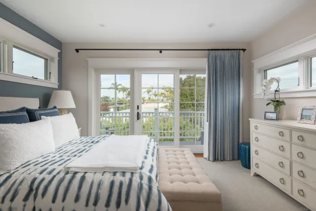 a bedroom with a bed and a couch