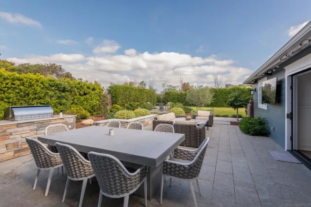 a view of an outdoor space with furniture and garden