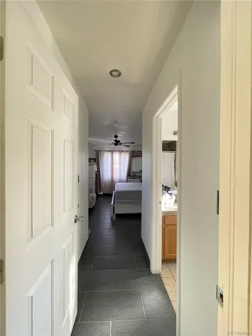a view of a hallway with white walls