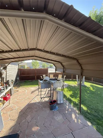 a view of yard with patio