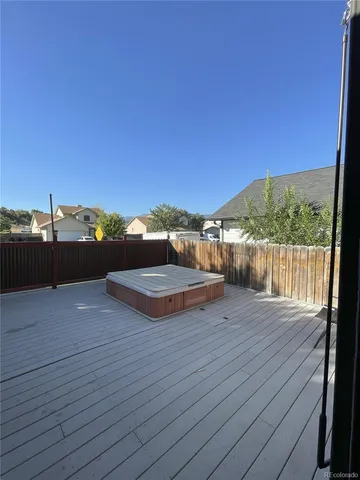 a view of a balcony with wooden floor