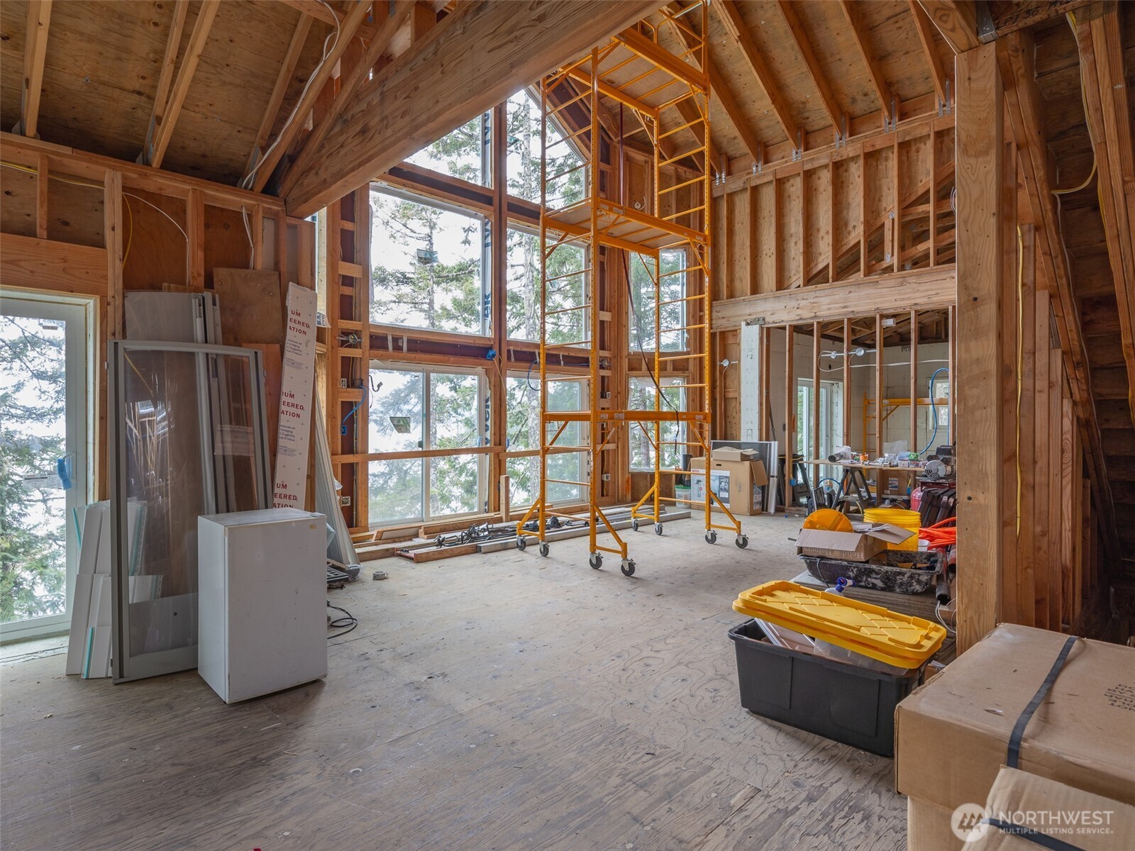 291 Pleasant Harbor Road Brinnon, WA 98320 - Photo 19 of 40 a room with furniture and a large window