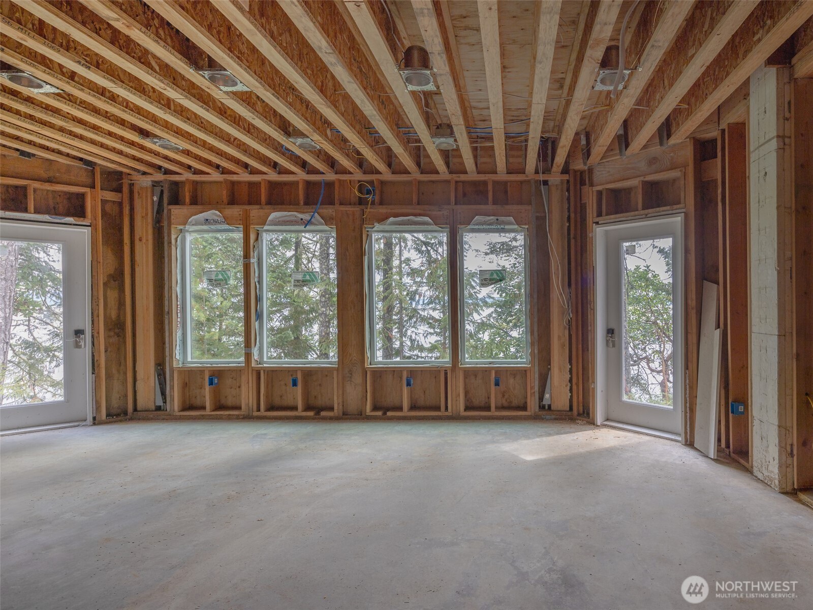 291 Pleasant Harbor Road Brinnon, WA 98320 - Photo 29 of 40 a view of an empty room with a fireplace