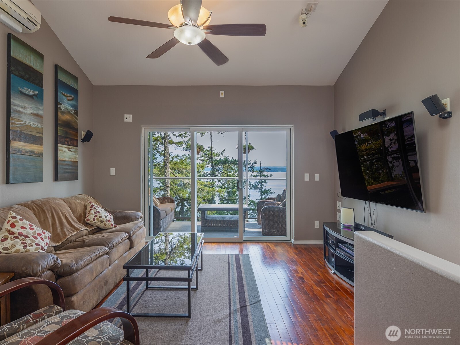 291 Pleasant Harbor Road Brinnon, WA 98320 - Photo 6 of 40 a living room with furniture and a flat screen tv