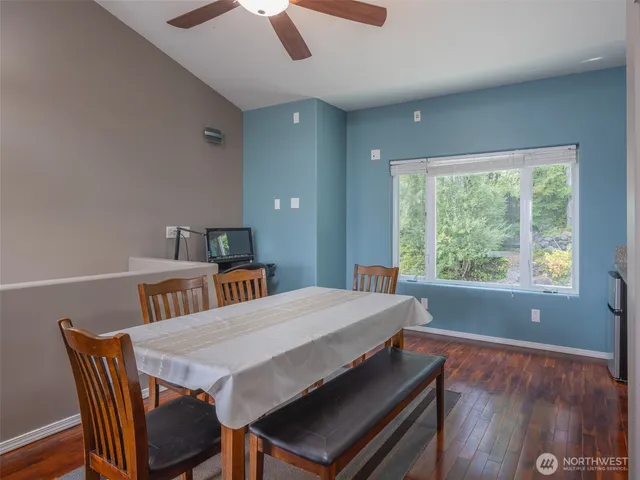 a view of a dining room with furniture window and wooden floor