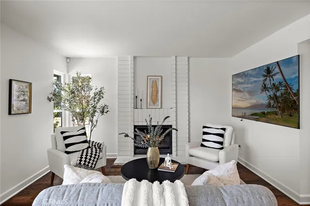 a view of a livingroom with furniture and wooden floor